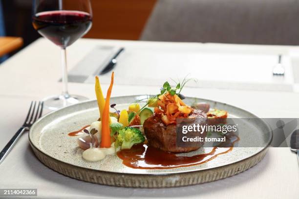 grilled steak on plate with vegetables - silver service stock pictures, royalty-free photos & images