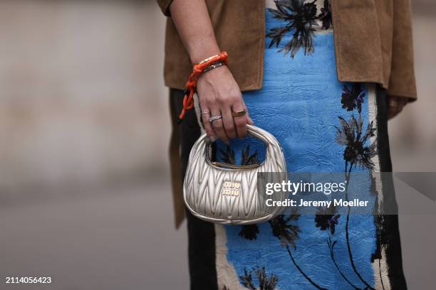 Karin Teigl seen wearing Zara blue / white / black print pattern midi long skirt, Miu Miu brown suede leather blazer jacket, Miu Miu silver leather...