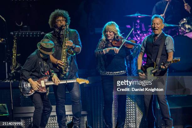 Nils Lofgren, Jake Clemons, Soozie Tyrell, and Bruce Springsteen of Bruce Springsteen and the E Street Band perform on stage at Pechanga Arena on...