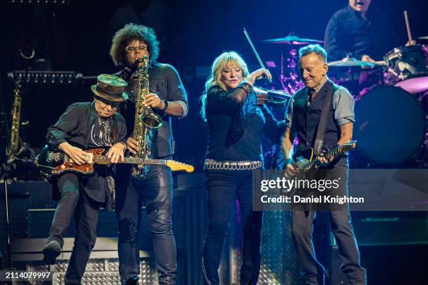 Nils Lofgren, Jake Clemons, Soozie Tyrell, and Bruce Springstee of Bruce Springsteen and the E Street Band perform on stage at Pechanga Arena on...