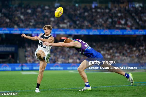 Charlie Curnow of the Blues kicks the ball during the 2024 AFL Round 03 match between the North Melbourne Kangaroos and the Carlton Blues at Marvel...