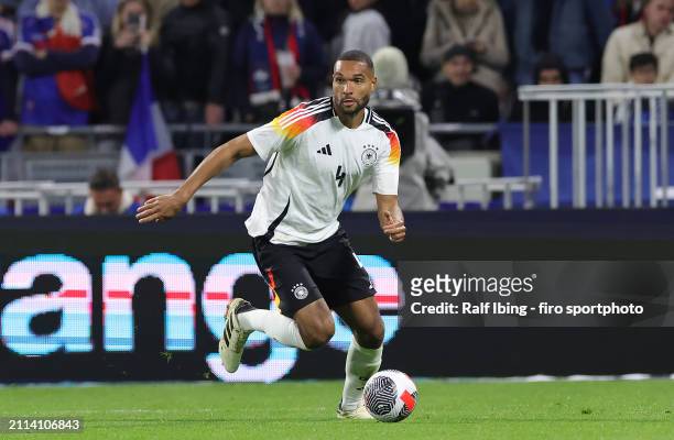 Jonathan Tah of Germany plays the ball during the international friendly match between France and Germany at Groupama Stadium on March 23, 2024 in...