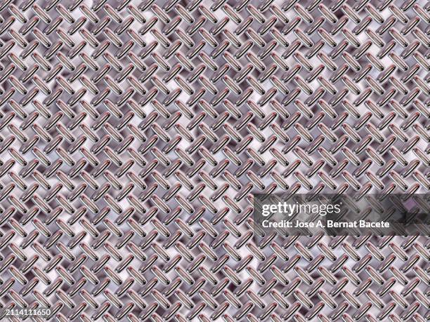 bronze colored metallic background with raised rectangular rivets. - intertwined circles stock pictures, royalty-free photos & images
