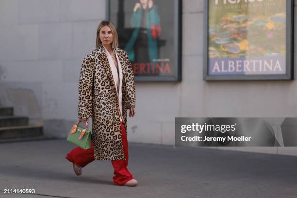 Karin Teigl seen wearing Zara light pink silk long suit vest, Zara red silk long wide leg pants, H&M Studios leopard print pattern long coat, Hermès...