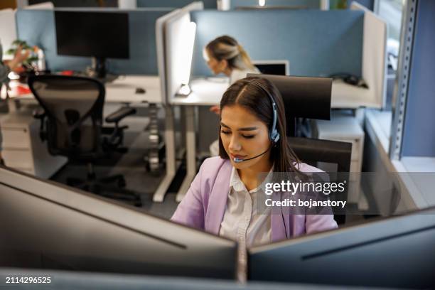 call center agent with headset working on support line in office - dispatcher stock pictures, royalty-free photos & images