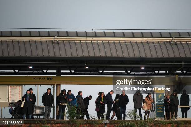 Commuters make their way to work in Manchester City centre on March 26, 2024 in Manchster, United Kingdom. Today the Office Of National Statistics...