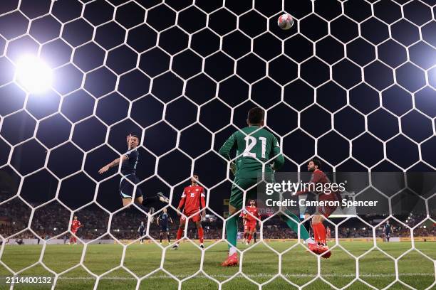 Mitchell Duke of Australia heads the ball during the FIFA World Cup 2026 Qualifier match between Australia Socceroos and Lebanon at GIO Stadium on...