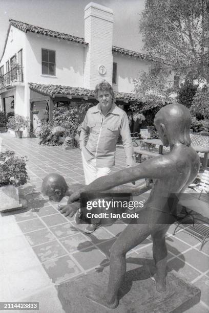 American film star Rock Hudson at home in his garden in Beverly Hills, Los Angeles on May 3rd 1977.