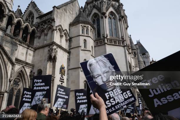 Supporters of Julian Assange gather at the Royal Courts of Justice on March 26, 2024 in London, England. The decision follows two days of hearings on...