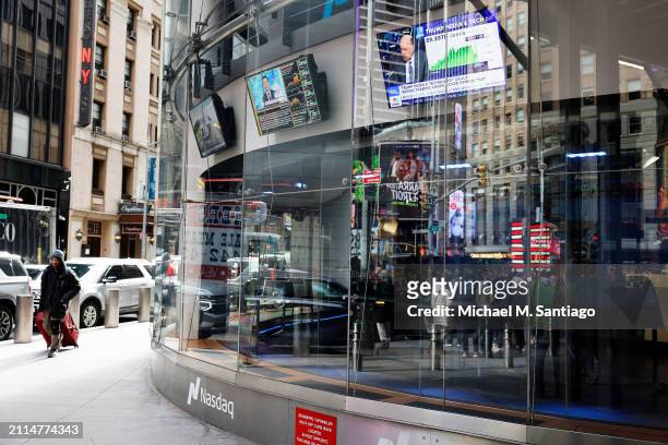 News of Trump Media & Technology Group public trading is seen on television screens at the Nasdaq Marketplace on March 26, 2024 in New York City....