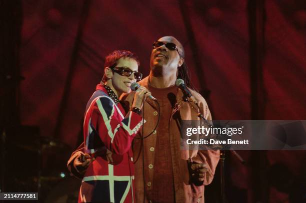 Scottish singer-songwriter Annie Lennox and American singer-songwriter Stevie Wonder on stage during the Brit Awards at the London Arena, London, UK,...