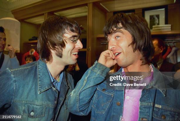 English singer/songwriters Liam Gallagher and Noel Gallagher attend a party for the opening of the Tommy Hilfiger store on New Bond Street, London,...