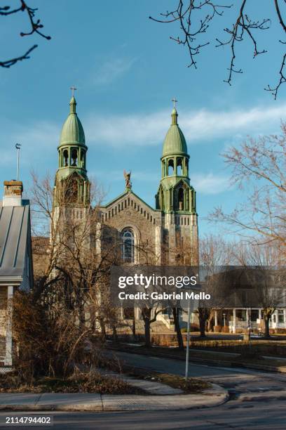church by the lachine canal in montreal - lachine canal stock pictures, royalty-free photos & images