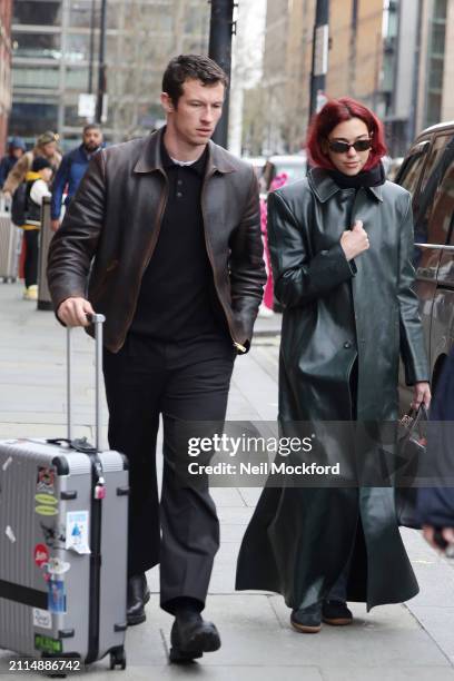 Dua Lipa and Callum Turner arriving at London St Pancras Station after taking the Eurostar from Paris on March 26, 2024 in London, England.