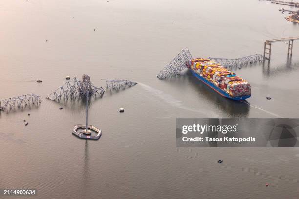 In an aerial view, cargo ship Dali is seen after running into and collapsing the Francis Scott Key Bridge on March 26, 2024 in Baltimore, Maryland....