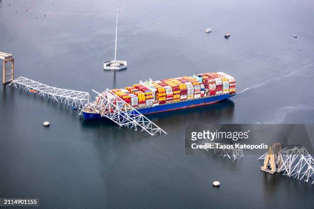 In an aerial view, cargo ship Dali is seen after running into and collapsing the Francis Scott Key Bridge on March 26, 2024 in Baltimore, Maryland....