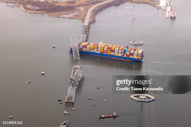 In an aerial view, cargo ship Dali is seen after running into and collapsing the Francis Scott Key Bridge on March 26, 2024 in Baltimore, Maryland....