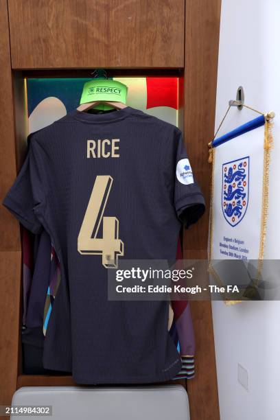 The captain's armband and a pennant are seen alongside the shirt of Declan Rice of England in the dressing room prior to the international friendly...