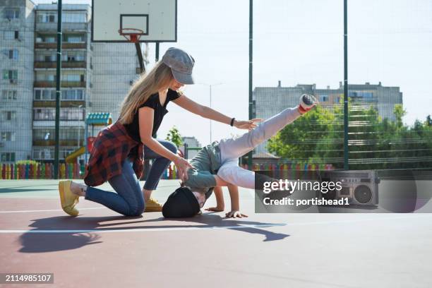 mother and son listening music, having fun and practicing breakdance - boom box stock pictures, royalty-free photos & images