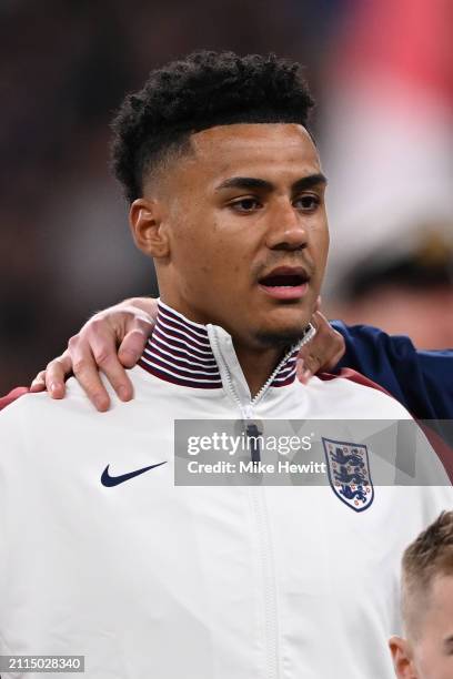 Ollie Watkins of England lines up for the National Anthems ahead of the international friendly match between England and Brazil at Wembley Stadium on...