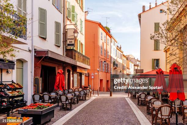 cozy street with cafes in le suquet - cannes old town, french riviera, france - cote d azur ストックフォトと画像