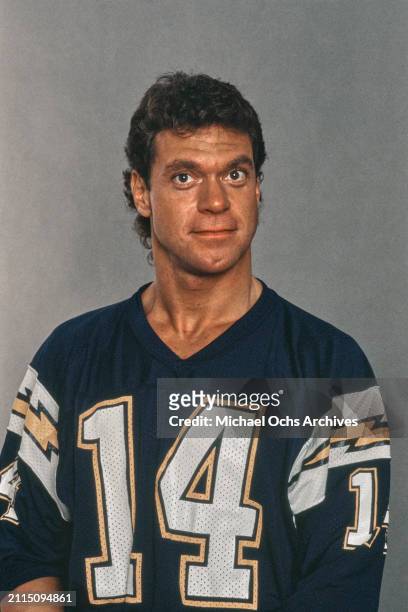 American actor and comedian Joe Piscopo, wearing a dark blue American football shirt with yellow and white flashes on the sleeves, and the number...