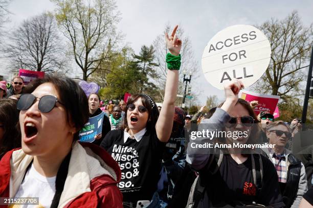 Demonstrators participate in a abortion-rights rally outside the Supreme Court as the justices of the court hear oral arguments in the case of the...