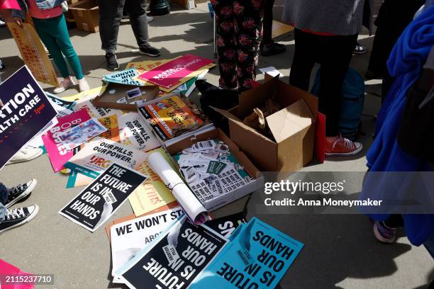 Demonstrators participate in a abortion-rights rally outside the Supreme Court as the justices of the court hear oral arguments in the case of the...