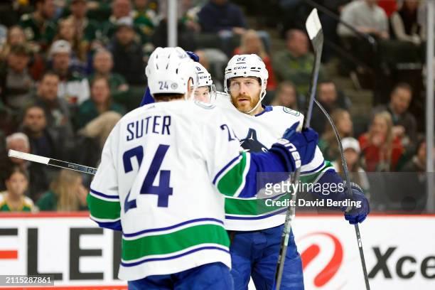 Ian Cole of the Vancouver Canucks celebrates his goal against the Minnesota Wild with teammates in the first period at Xcel Energy Center on February...