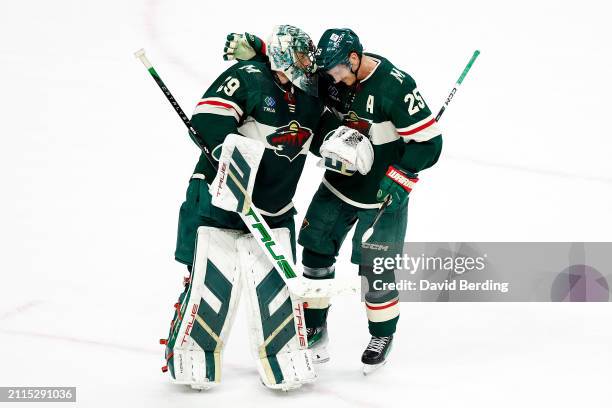 Marc-Andre Fleury and Jonas Brodin of the Minnesota Wild celebrate their victory against the Vancouver Canucks after the game at Xcel Energy Center...
