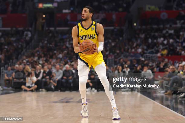 Tyrese Haliburton of the Indiana Pacers handles the ball during the first quarter against the Los Angeles Clippers at Crypto.com Arena on March 25,...