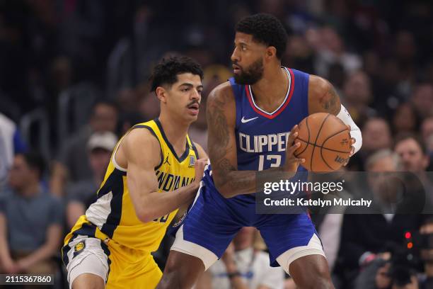 Paul George of the Los Angeles Clippers handles the ball against Ben Sheppard of the Indiana Pacers during the first quarter at Crypto.com Arena on...
