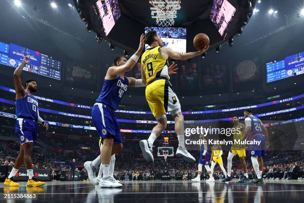 McConnell of the Indiana Pacers attempts a layup against Ivica Zubac of the Los Angeles Clippers during the first quarter at Crypto.com Arena on...