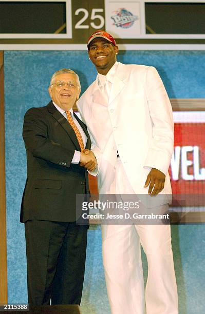 LeBron James who was selected number one overall in the first round by the Cleveland Cavailiers shakes hands with NBA Commissioner David Stern during...
