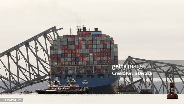 The cargo ship Dali sits in the water after running into and collapsing the Francis Scott Key Bridge on March 26, 2024 in Baltimore, Maryland....