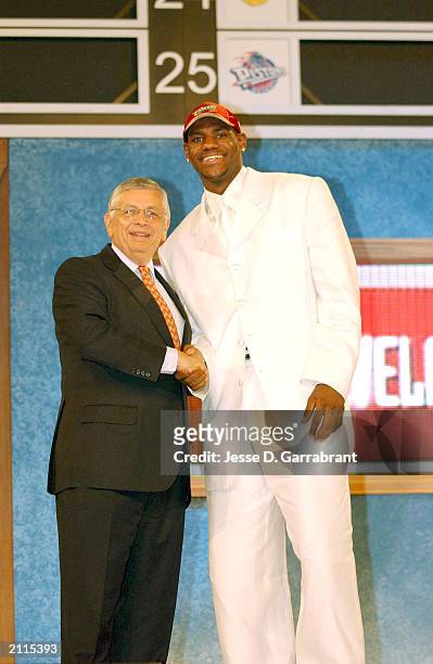 LeBron James who was selected number one overall in the first round by the Cleveland Cavailiers shakes hands with NBA Commissioner David Stern during...
