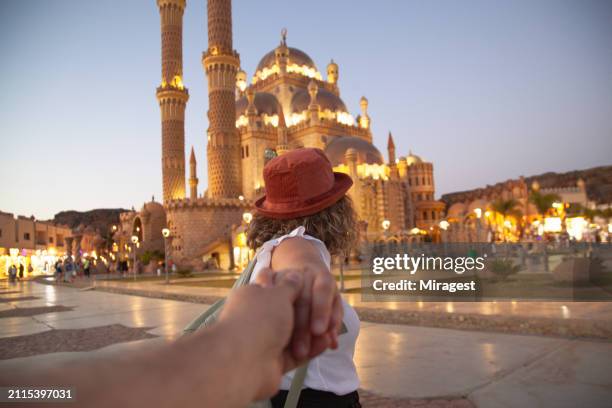 tourist woman posing holding hands and visits in al sahaba mosque, (el mustafa mosque) in sharm el sheikh, egypt - sinai egypt stock pictures, royalty-free photos & images