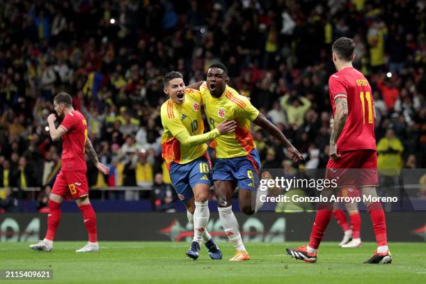 Jhon Cordoba of Colombia celebrates scoring his team's first goal with teammate James Rodriguez during the international friendly match between...