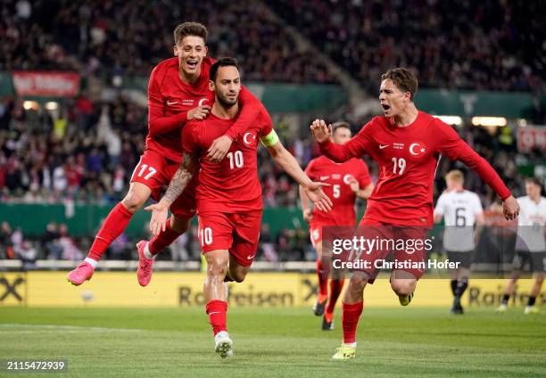 Hakan Çalhanoglu of Turkey celebrates with teammates after scoring his team's first goal during the international friendly match between Austria and...