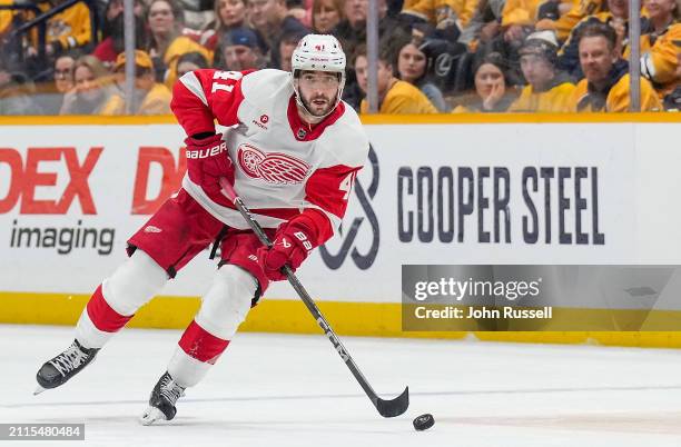 Shayne Gostisbehere of the Detroit Red Wings skates against the Nashville Predators during an NHL game at Bridgestone Arena on March 23, 2024 in...