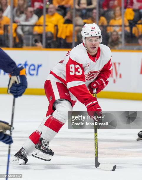Alex DeBrincat of the Detroit Red Wings skates against the Nashville Predators during an NHL game at Bridgestone Arena on March 23, 2024 in...