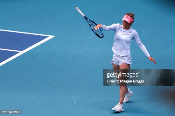 Yulia Putintseva of Kazakhstan throws her racket on the ground during her women's singles match against Victoria Azarenka during the Miami Open at...