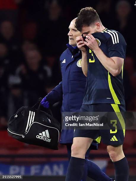 Andrew Robertson of Scotland leaves the field after suffering an injury during the international friendly match between Scotland and Northern Ireland...