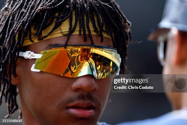 Yophery Rodriguez talks with third base coach Rafael Neda of the Milwaukee Brewers before the second inning of a spring training game at Salt River...