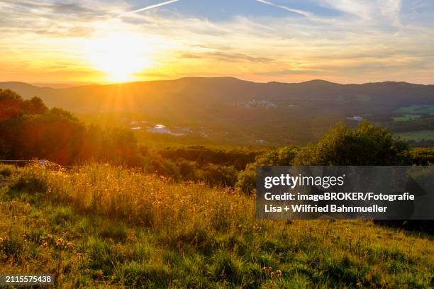 sunset on the kreuzberg in the rhoen, kreuzberg near bischofsheim, rhoen, lower franconia, bavaria, germany, europe - rhön stock-fotos und bilder