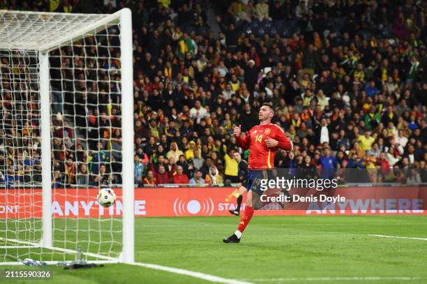 Aymeric Laporte of Spain watches on as Rodrygo of Brazil scores his team's first goal during the friendly match between Spain and Brazil at Estadio...
