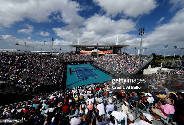 Jannik Sinner of Italy returns a shot against Christopher O'Connell of Australia during their match on day 11 of the Miami Open at Hard Rock Stadium...
