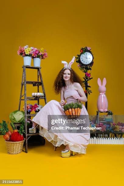 beautiful girl wearing pink dress - giant rabbit stock pictures, royalty-free photos & images