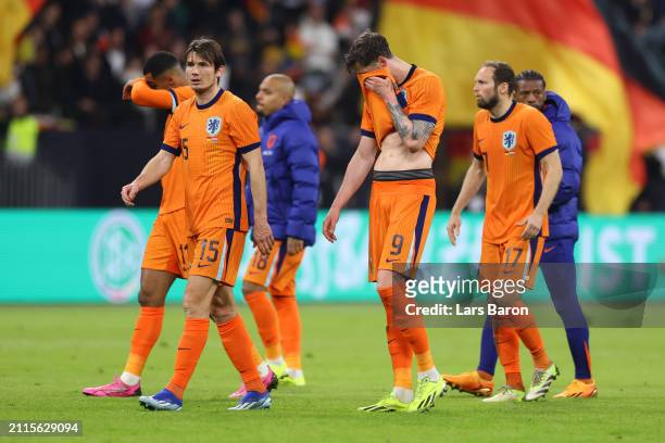 Marten de Roon and Wout Weghorst of Netherlands look dejected after the team's defeat during the International Friendly match between Germany and...