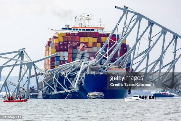 The cargo ship Dali sits in the water after running into and collapsing the Francis Scott Key Bridge on March 26, 2024 in Baltimore, Maryland....